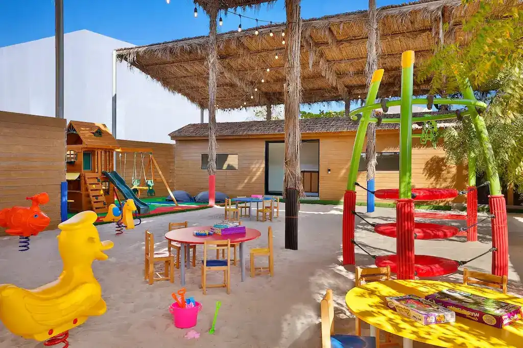Shaded outdoor kids club and playground