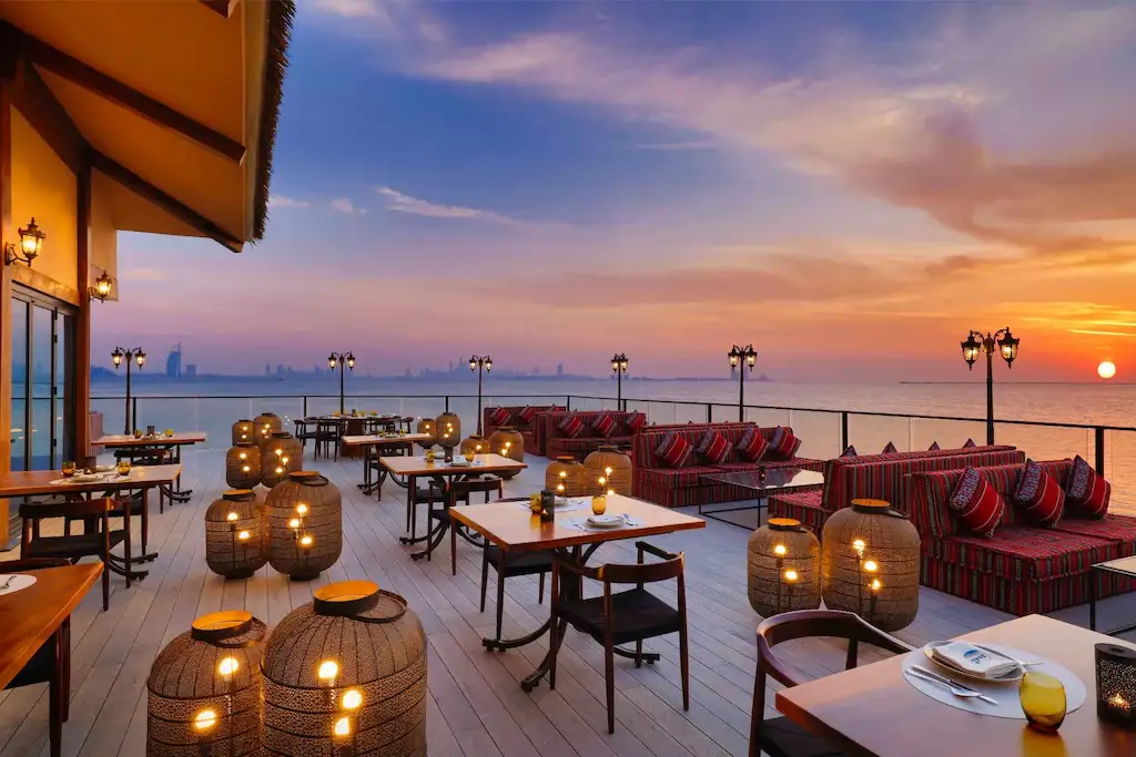 Sunset dining terrace overlooking the Arabian Gulf
